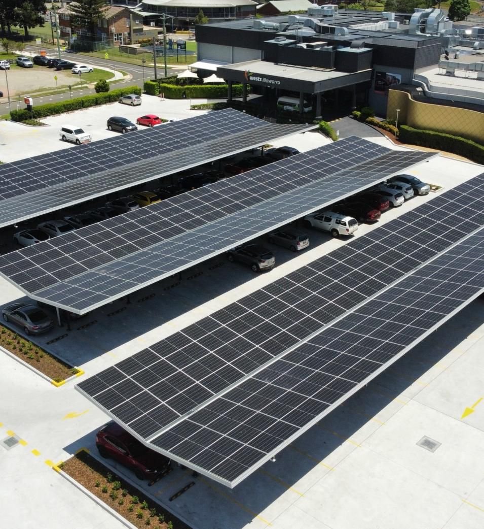 Solar car shade structures over a car park